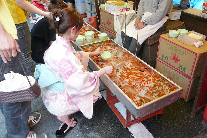 Photo of the Day: Goldfish Scooping